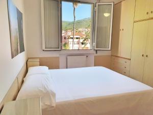 A bed or beds in a room at Ligure Residence