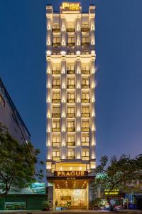a tall building with lights on top of it at Prague Hotel in Da Nang