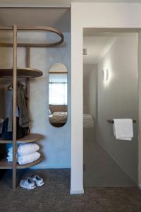 a room with a bunk bed and a mirror at Carina - Design&Lifestyle hotel in Zermatt