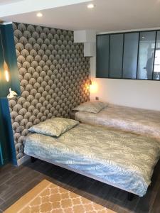Llit o llits en una habitació de Moulin De Coupigny