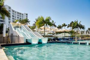 a slide in a swimming pool at a resort at Breakers Resort in Durban