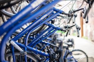 a group of blue bikes parked next to each other at Treck Hostel in Ghent
