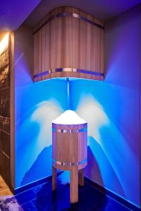 a blue wall with a table in a room at Carina - Design&Lifestyle hotel in Zermatt