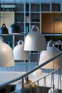 
a row of lamps hanging from a ceiling at Carina - Design&Lifestyle hotel in Zermatt
