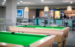 a billiard room with two pool tables at Yarnfield Park Training And Conference Centre in Stone