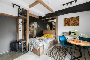 Voodi või voodid majutusasutuse Aparthotel Narciarska 2 toas +256 fotot