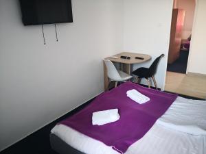 Postel nebo postele na pokoji v ubytování Thomas Panzió