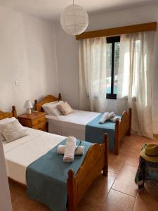 Postel nebo postele na pokoji v ubytování Seashell Apartments