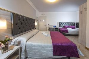 Cama o camas de una habitación en Hotel Playa