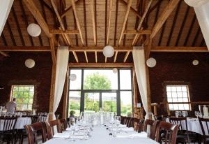 a long table in a room with tables and chairs at Einhaus in Möttau