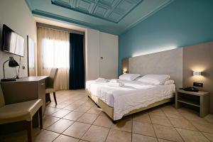 Ένα ή περισσότερα κρεβάτια σε δωμάτιο στο Albergo Papillon