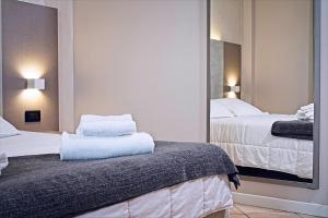 Ένα ή περισσότερα κρεβάτια σε δωμάτιο στο Albergo Papillon