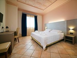 Voodi või voodid majutusasutuse Albergo Papillon toas