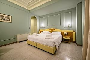 Ένα ή περισσότερα κρεβάτια σε δωμάτιο στο Albergo Papillon