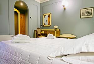 Ένα ή περισσότερα κρεβάτια σε δωμάτιο στο Albergo Papillon