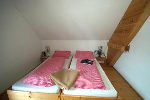 Voodi või voodid majutusasutuse Straniger Alm toas