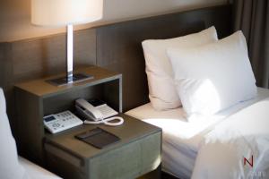 Postel nebo postele na pokoji v ubytování Hotel Manu Seoul