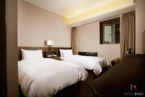 Postel nebo postele na pokoji v ubytování Hotel Manu Seoul