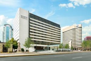 a large white building with a sign on the side of it at Hyatt Regency Bethesda near Washington D.C. in Bethesda