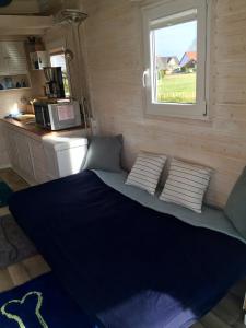 A bed or beds in a room at Tinyhouse Bamberg