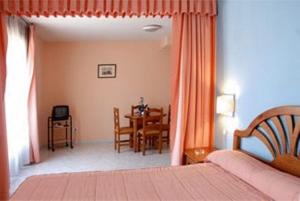 Postel nebo postele na pokoji v ubytování Hotel Laberinto