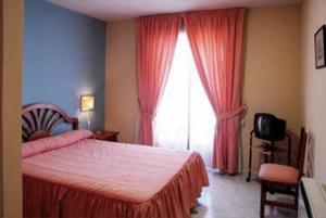 Postel nebo postele na pokoji v ubytování Hotel Laberinto