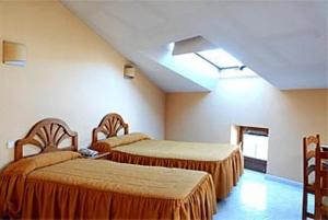 Postel nebo postele na pokoji v ubytování Hotel Laberinto