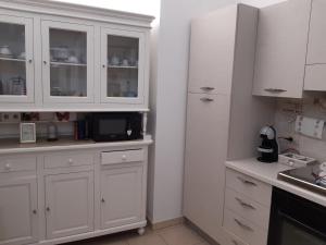 Kuchyň nebo kuchyňský kout v ubytování appartamento butterfly