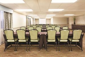a conference room with a long table and chairs at La Quinta by Wyndham Bonita Springs Naples North in Bonita Springs
