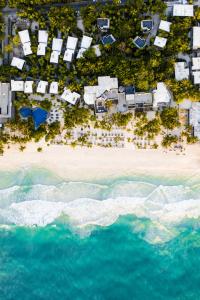 an aerial view of a beach with condos and the ocean at Casa Malca in Tulum