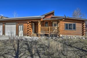 a log home with a porch and a deck at Cabin by Rio Grande - 19 Mi to Wolf Creek! in South Fork