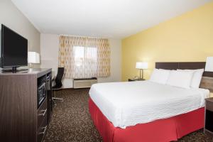Кровать или кровати в номере Days Inn by Wyndham Phoenix North