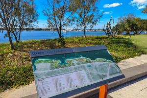 a sign in a park with a map at Palmerston Tower in Gold Coast