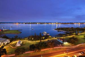 a view of a large body of water at night at Palmerston Tower in Gold Coast