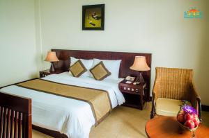 Ein Bett oder Betten in einem Zimmer der Unterkunft Sun Spa Resort & Villa