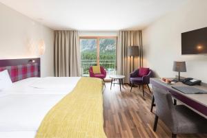 Łóżko lub łóżka w pokoju w obiekcie Hotel Allegra 3 Stern Superior