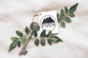 a pair of scissors sitting on top of a green plant at Five14 B&B in Pātan