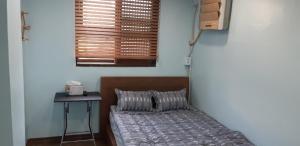 Postel nebo postele na pokoji v ubytování Kimstay 9
