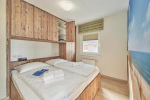 Ένα ή περισσότερα κρεβάτια σε δωμάτιο στο Haus Pamir _ Fewo 24