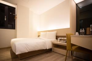 Cama o camas de una habitación en Beauty Avenue Inn
