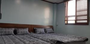 Postel nebo postele na pokoji v ubytování Kimstay 9