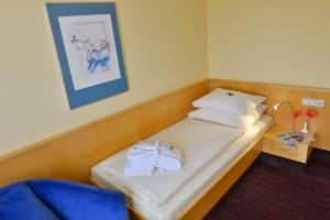 Postel nebo postele na pokoji v ubytování Roomingtons Lüneburger Heide