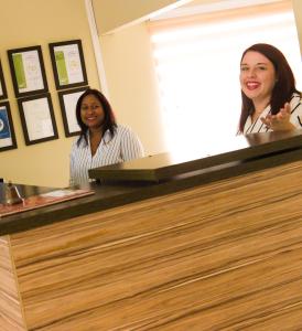 two women sitting at a counter in a salon at BM Gardens in Edenvale