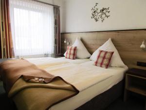 
Ein Bett oder Betten in einem Zimmer der Unterkunft Hotel Restaurant Des Ardennes
