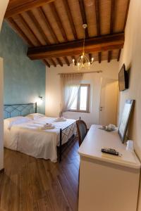 Fattoria L'Olmetto客房内的一张或多张床位