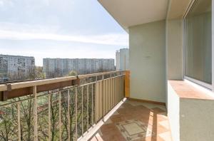 a balcony with a view of a city at Rooms4Less in Gdańsk