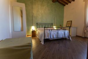 Fattoria L'Olmetto客房内的一张或多张床位
