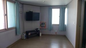 TV a/nebo společenská místnost v ubytování K Guesthouse
