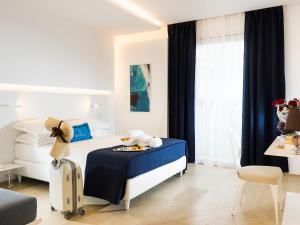 Кровать или кровати в номере White Bay