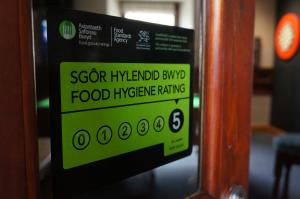 a sign that says seafood hyundaimph bump food hygiene rating at Castle Inn in Newport